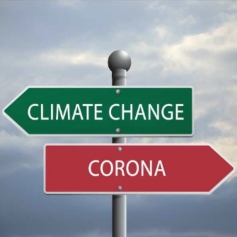 A green sign pointing to climate change and a red sign pointing to corona in the opposite direction.